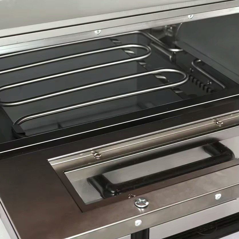 Inside the oven chamber showing the electric heating elements
