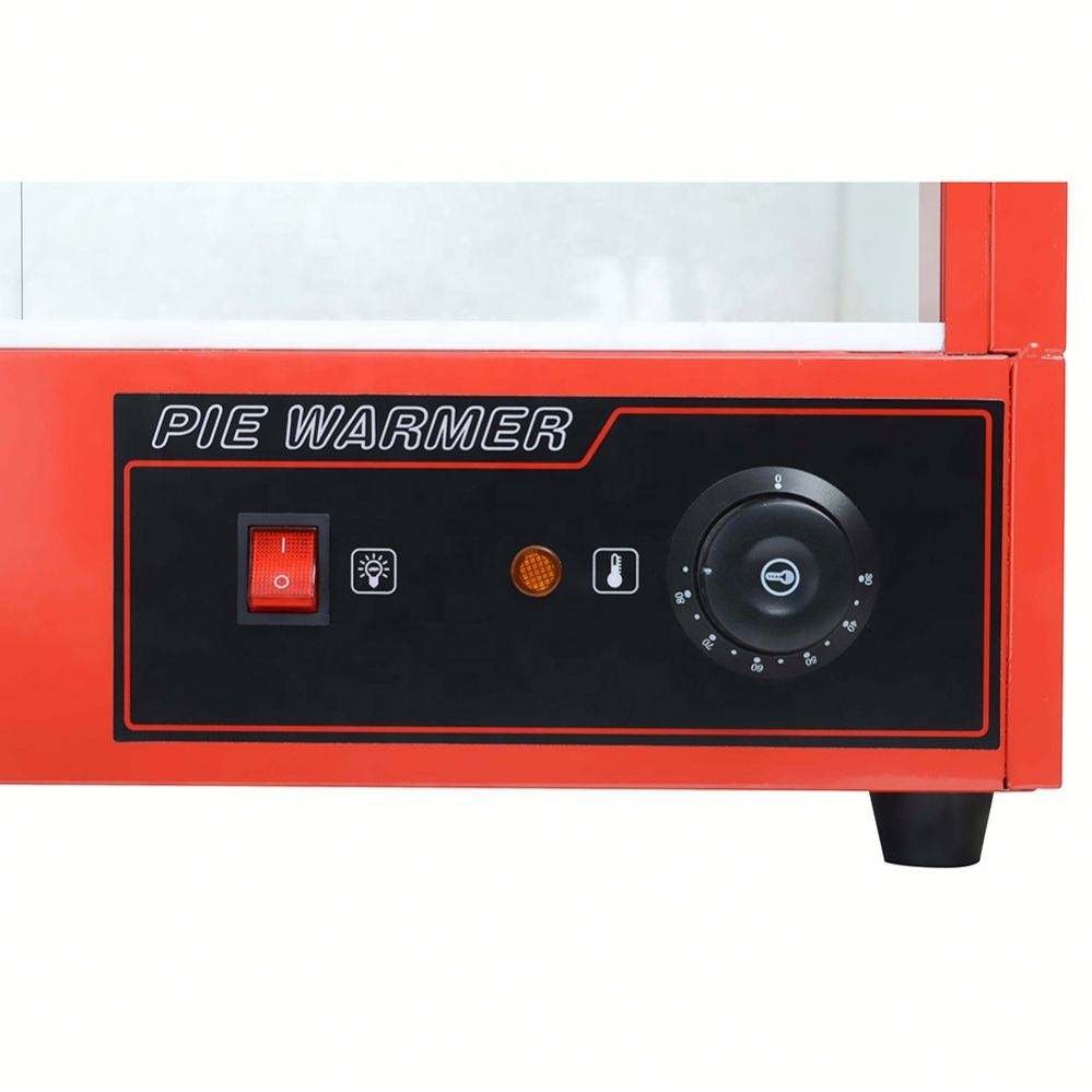 Close-up of the food warmer control panel with power, light and temperature knob