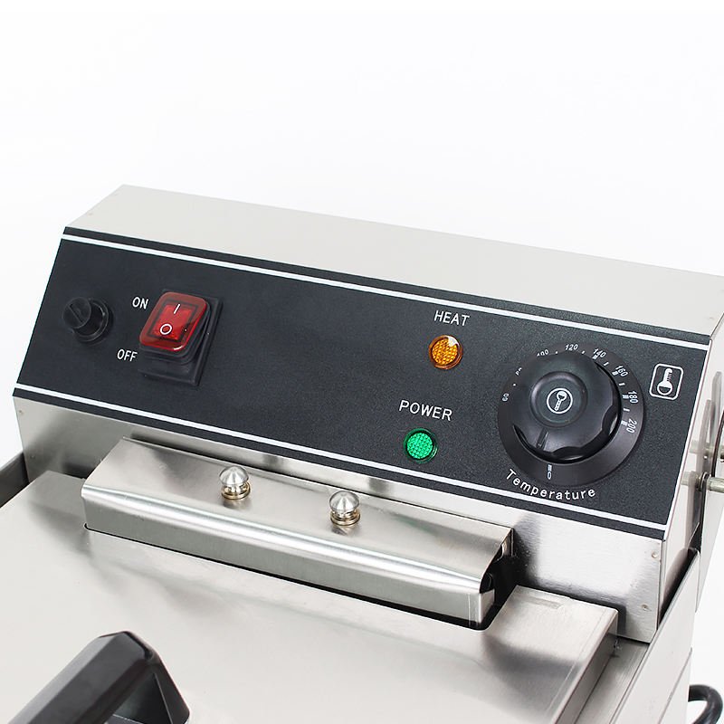 Close-up of the temperature dial, on/off switch and power and heat indicators