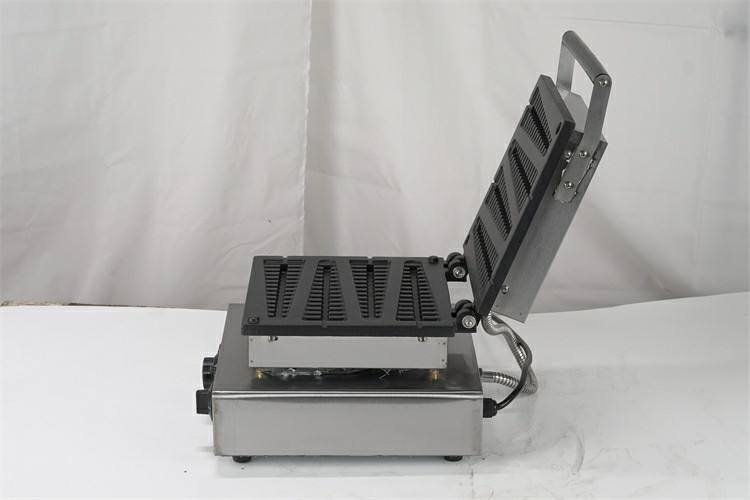Lolly waffle maker, open lid showing stick-mould plates