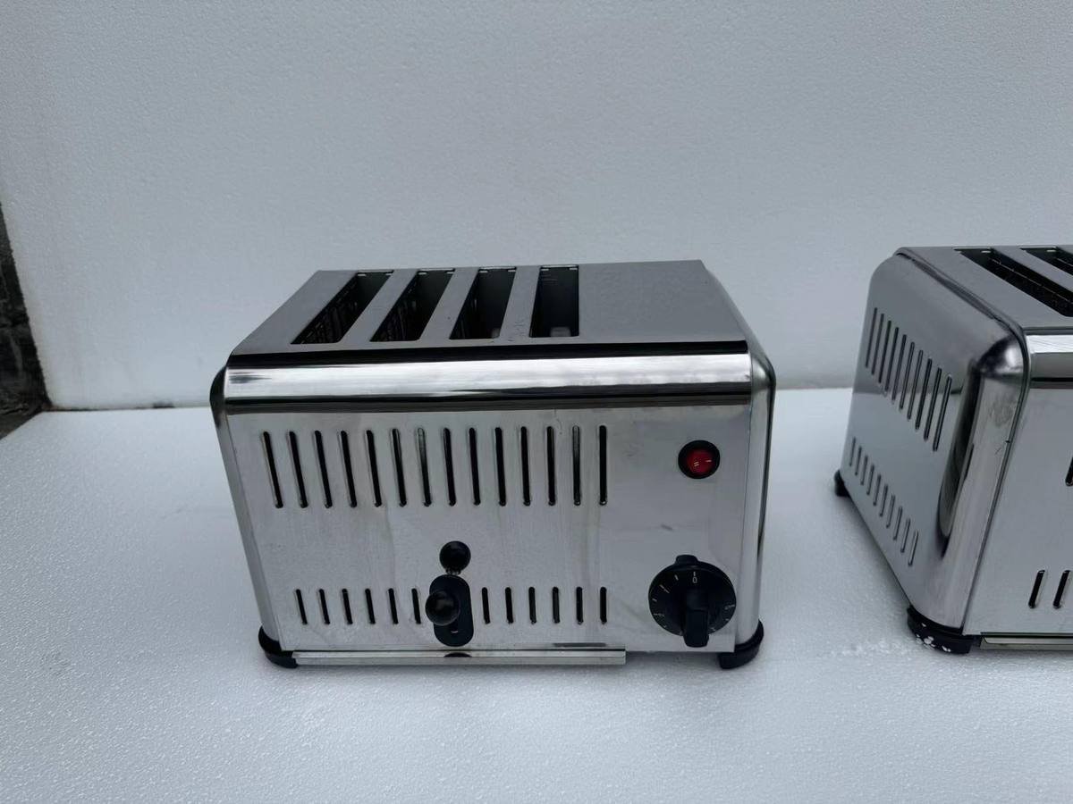 Two commercial 4 slice toasters side by side, stainless steel body